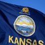 Die Zeit bis zur Staatsgründung wurde als Bleeding Kansas (blutendes Kansas) bekannt. Am 30. Mai 1854 wurde der so genannte „Kansas-Nebraska Act“ gesetzlich beschlossen. Damit wurden Nebraska und Kansas den Vereinigten Staaten als so genannte „Territorien“ angeschlossen. Die Territorien gehörten zwar zu den USA, waren aber noch keine Bundesstaaten mit entsprechenden Rechten. Siedler erschlossen das Kansas Territory schnell, teils auf eigene Faust, teils mit Hilfe von Ansiedlugsgesellschaften (z. B. die New England Emigrant Aid Company, die mehrere Städte gründete). Die nicht-indianische Bevölkerung wuchs schnell, auf 140.000 im Jahre 1865 und auf eine Million im Jahre 1880.[10] Das Leben im Kansas Territory war unsicher, da Befürworter und Gegner der Sklaverei (Abolitionisten) um die Mehrheit im zukünftigen Bundesstaat stritten und Guerillas ihr Unwesen trieben (vgl. Jayhawkers). Am 30. März 1855 fielen die so genannten „Border Ruffians“ (dt. ungefähr: „Grenz-Grobiane“) von Missouri kommend in Kansas ein und erzwangen die Wahl einer sklavereifreundlichen Regierung. In der Folgezeit kam es immer wieder zu gewaltsamen Zusammenstößen, z. B. dem Überfall des Abolitionisten John Brown auf Befürworter der Sklaverei im Jahre 1856, bei dem er und seine Söhne mehrere Personen ermordeten. In der intensiven politischen Auseinandersetzung zwischen Kräften für und gegen die Sklaverei wurden insgesamt vier Verfassungsentwürfe für den zukünftigen Bundesstaat abgestimmt. Am 29. Januar 1861 wurde Kansas als 34. Staat in die Union aufgenommen, mit dem Verbot der Sklaverei in der Verfassung.