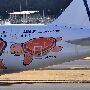 All Nippon Airways - Airbus A380-841 - JA383A "Flying Honu - Ra (Orange Turtle)" special colours<br />NRT - Terminal 1 Observatory - 22.03.2024 - 15:40