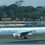 Air Asia - Airbus A320-216 - 9M-AQB "General Electric" special colours<br />SIN - 20.3.2023 - Gate C20 Terminal 1 Changi - 11:35