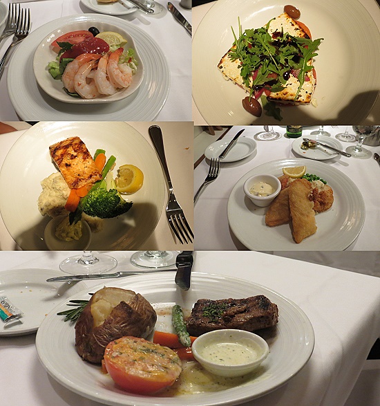 Essen im Restaurant - Krabbencocktail, gebackener Fetakäse, Lachs, panierte Fischplatte, Steak. 
